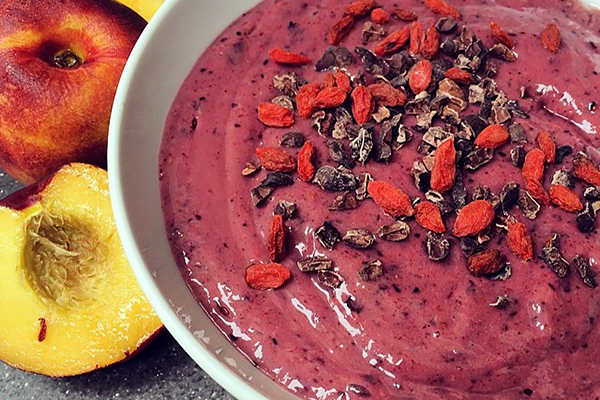 Two small spotty bananas, a baby avocado, a cup of frozen berries, a few splashes of brown rice milk, Inspiralled vitality mix & a dash of cinnamon, sprinkled with cacao nibs & gojiberries with a side of juicy nectarines. From laurentelford96.